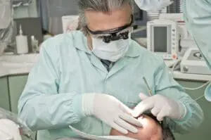 https://pixabay.com/photos/dentist-dental-care-dentistry-teeth-2530990/ Orthognathic surgery; oral surgeon performing surgery