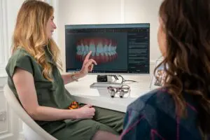 Dentist discussing dental implant options with a patient 