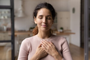Woman feeling calm with hands crossed